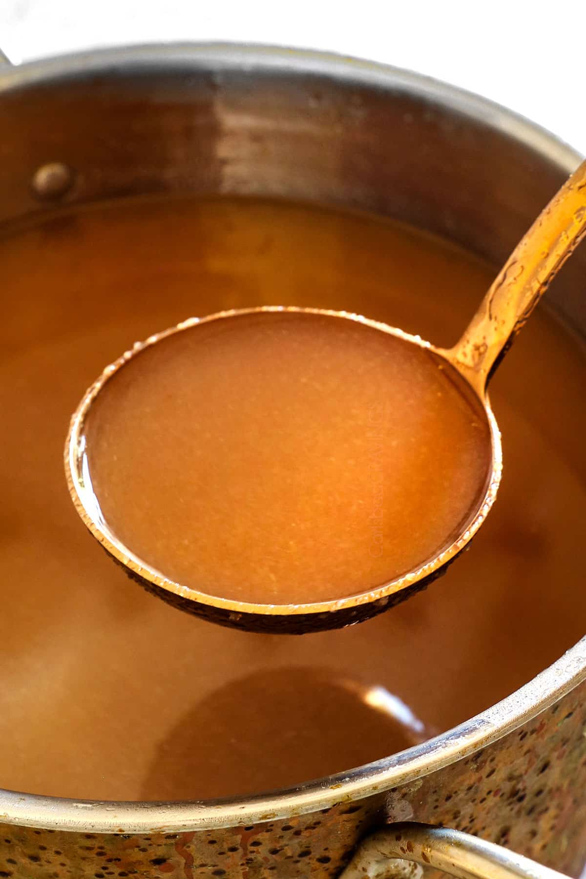 showing how to make apple cider recipe by adding brown sugar to the cider