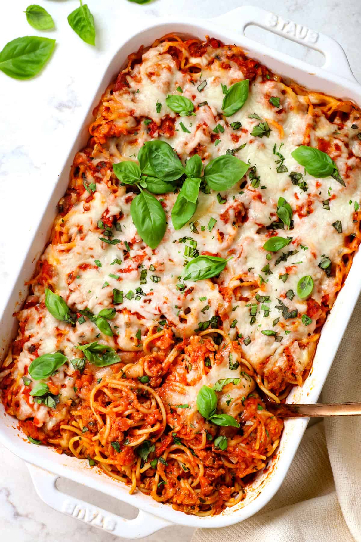 top view of baked spaghetti recipe in a 9x13 baking dish