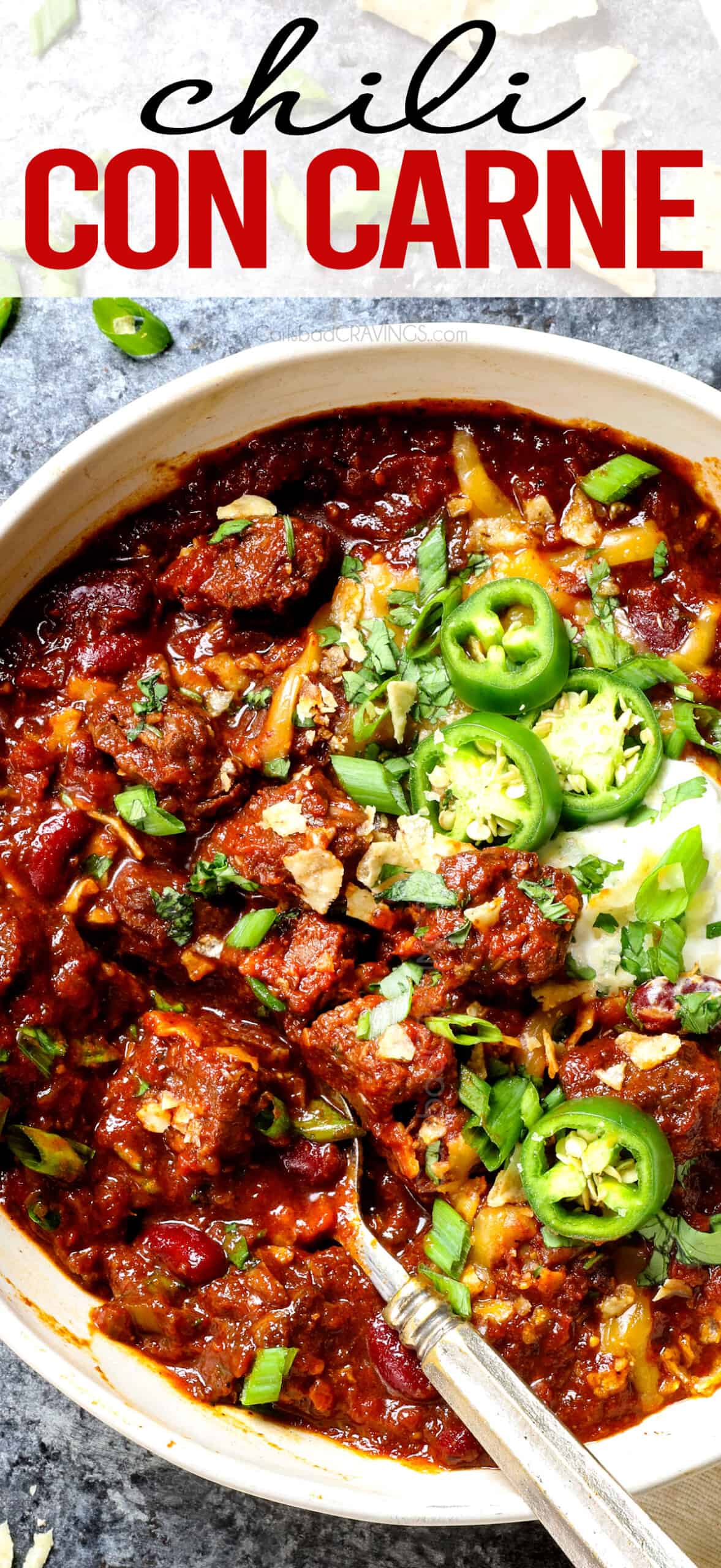 top view of chili con carne (beef chili) in a bowl with toppings