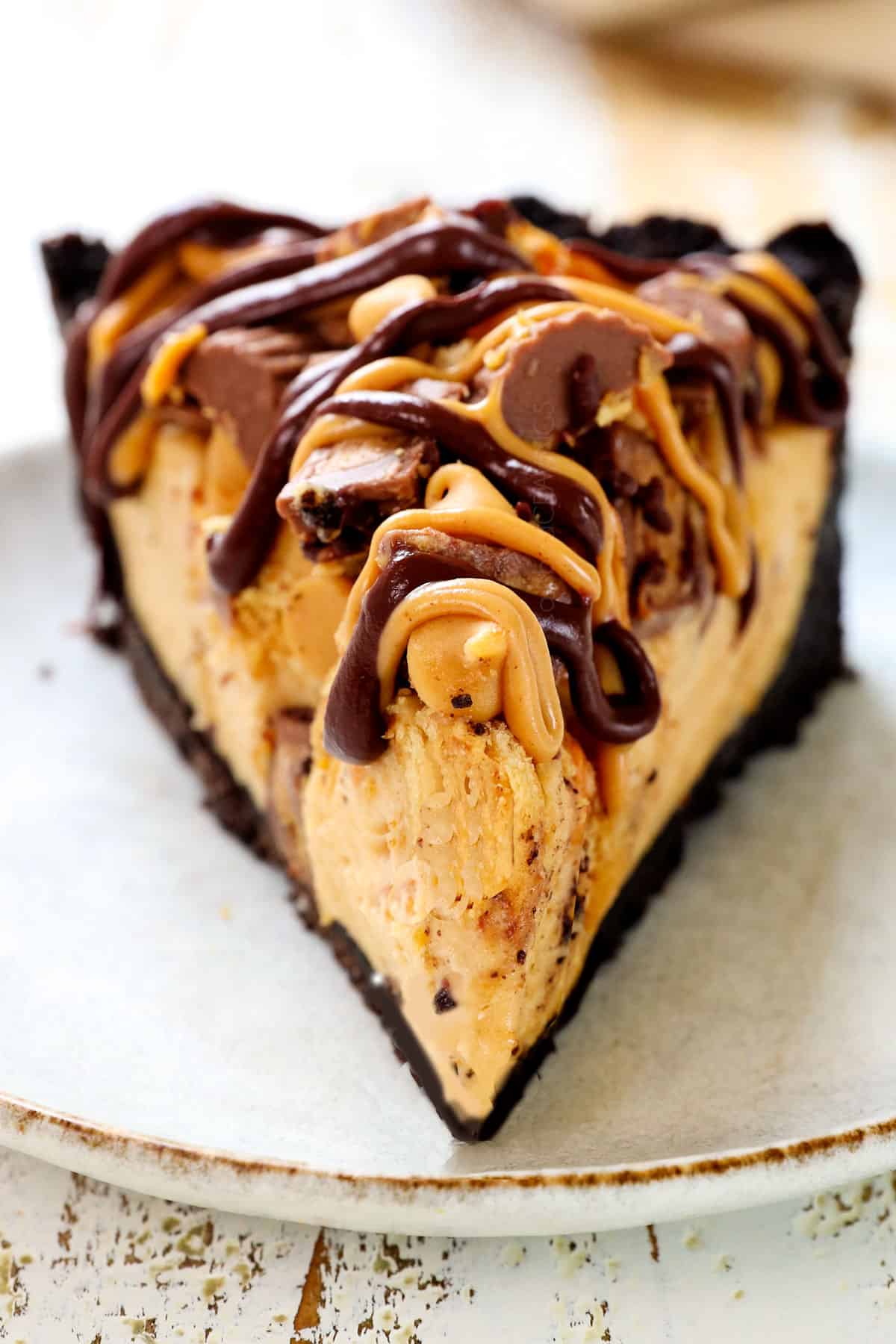 a slice no bake peanut butter pie on a topped with peanut butter chips