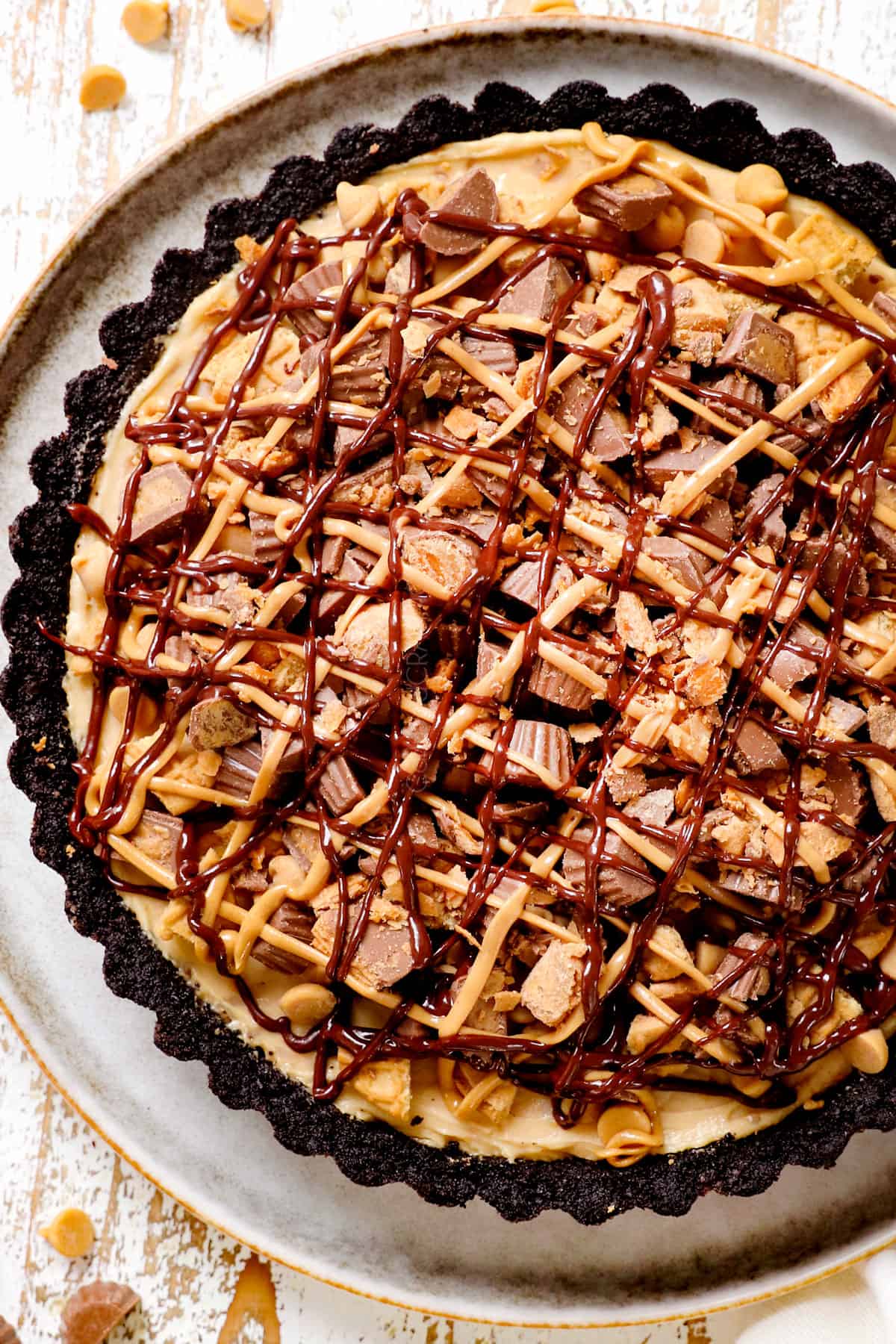 top view of peanut butter pie recipe on a plate topped with mini Reese's Peanut Butter Cups