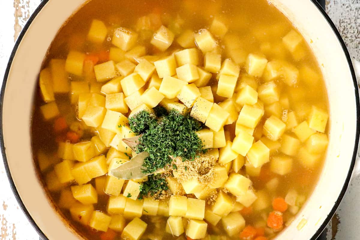 showing how to make potato soup by adding cubed potatoes, broth and seasonings