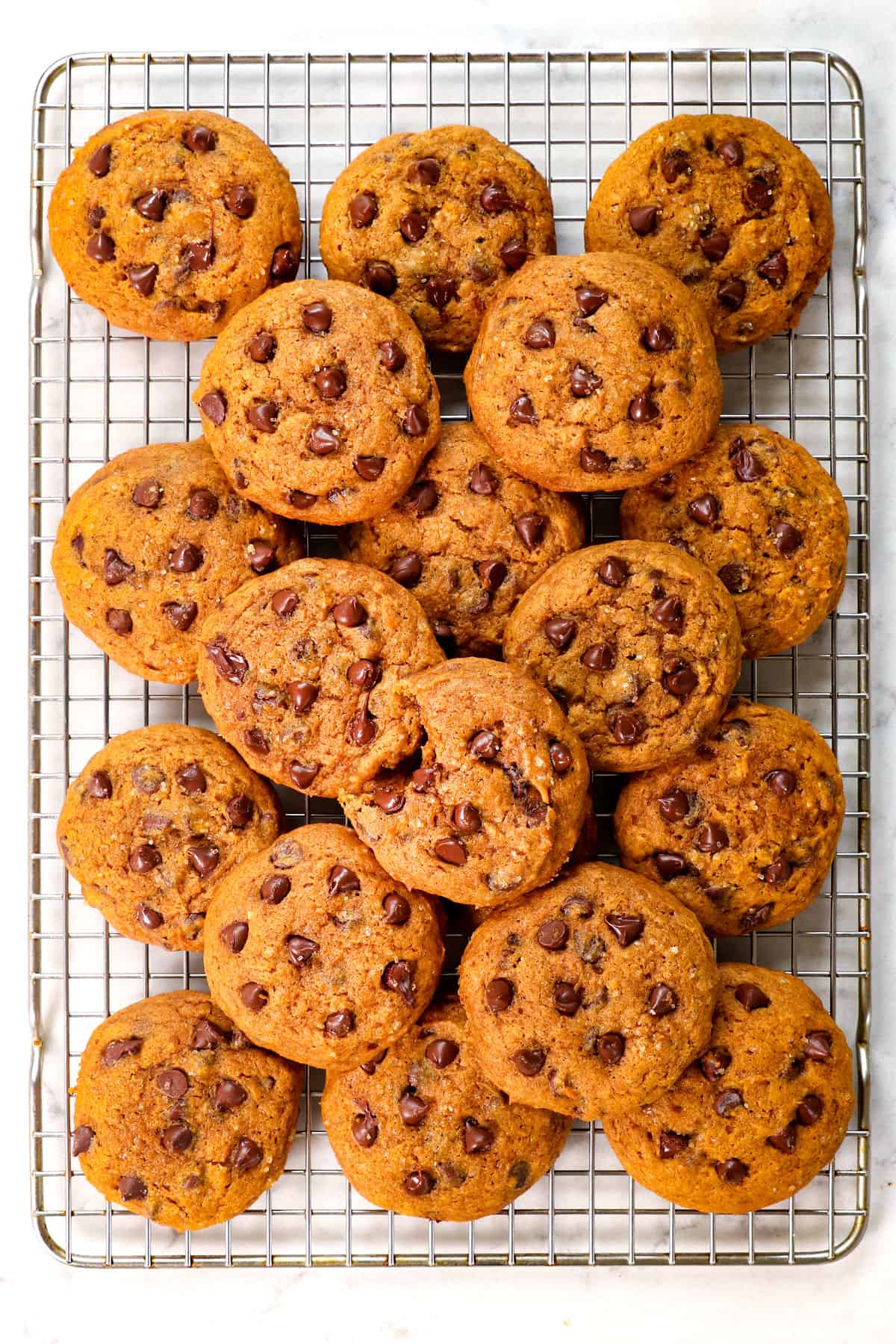 chocolate chip pumpkin cookies cooling on a baking rack