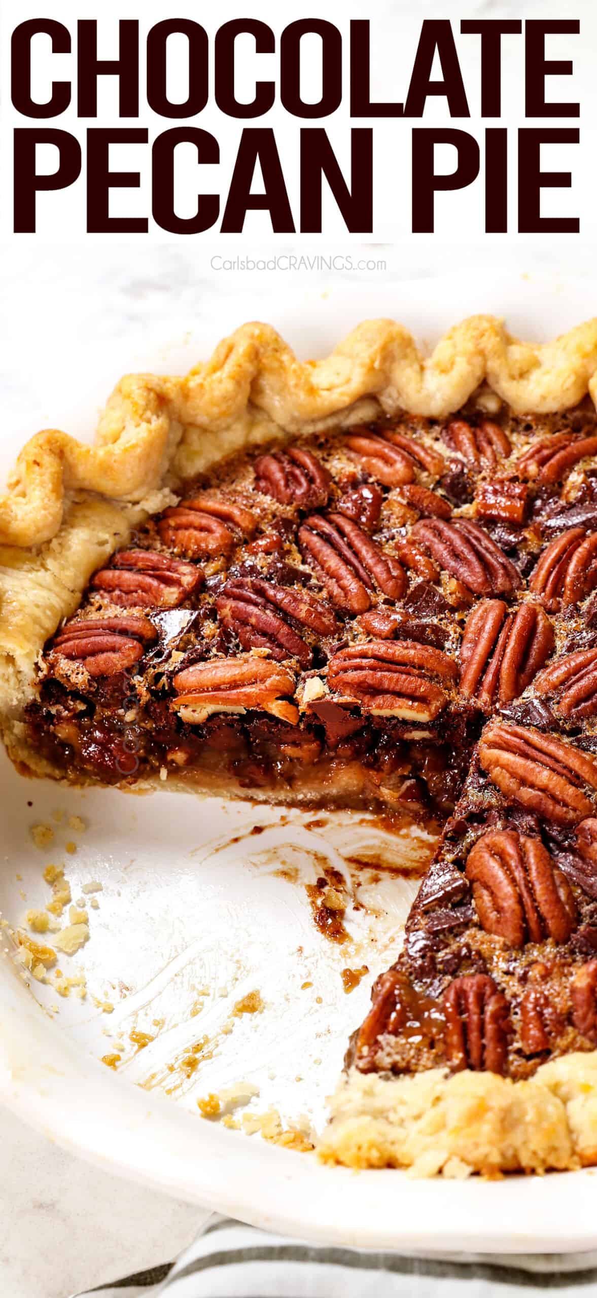 chocolate pecan pie in a white pie dish with slices missing showing the inside filling