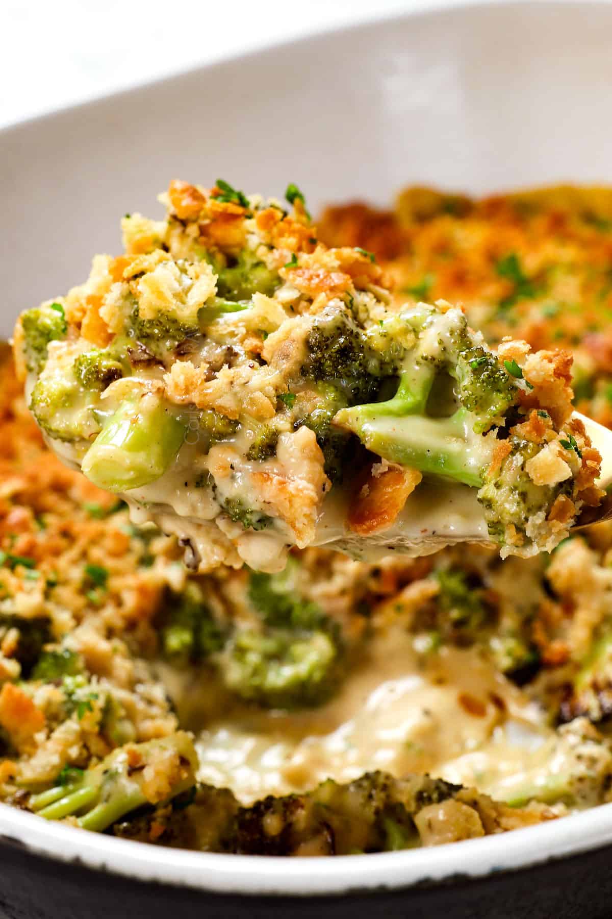 scooping up broccoli casserole recipe with a spoon 