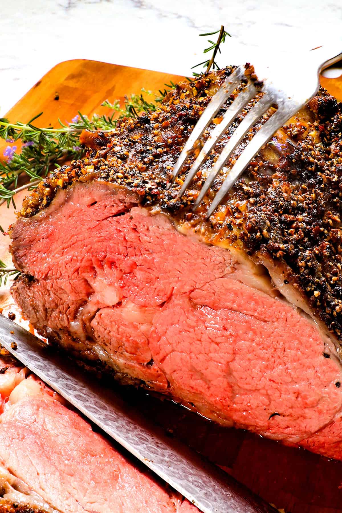 showing what perfect prime rib cooked to medium-rare looks like
