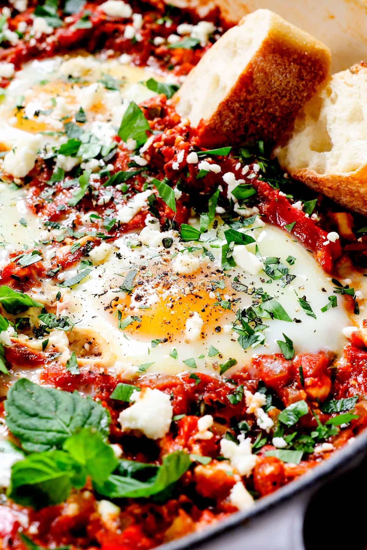 up close of egg shakshuka showing the sunny poached eggs
