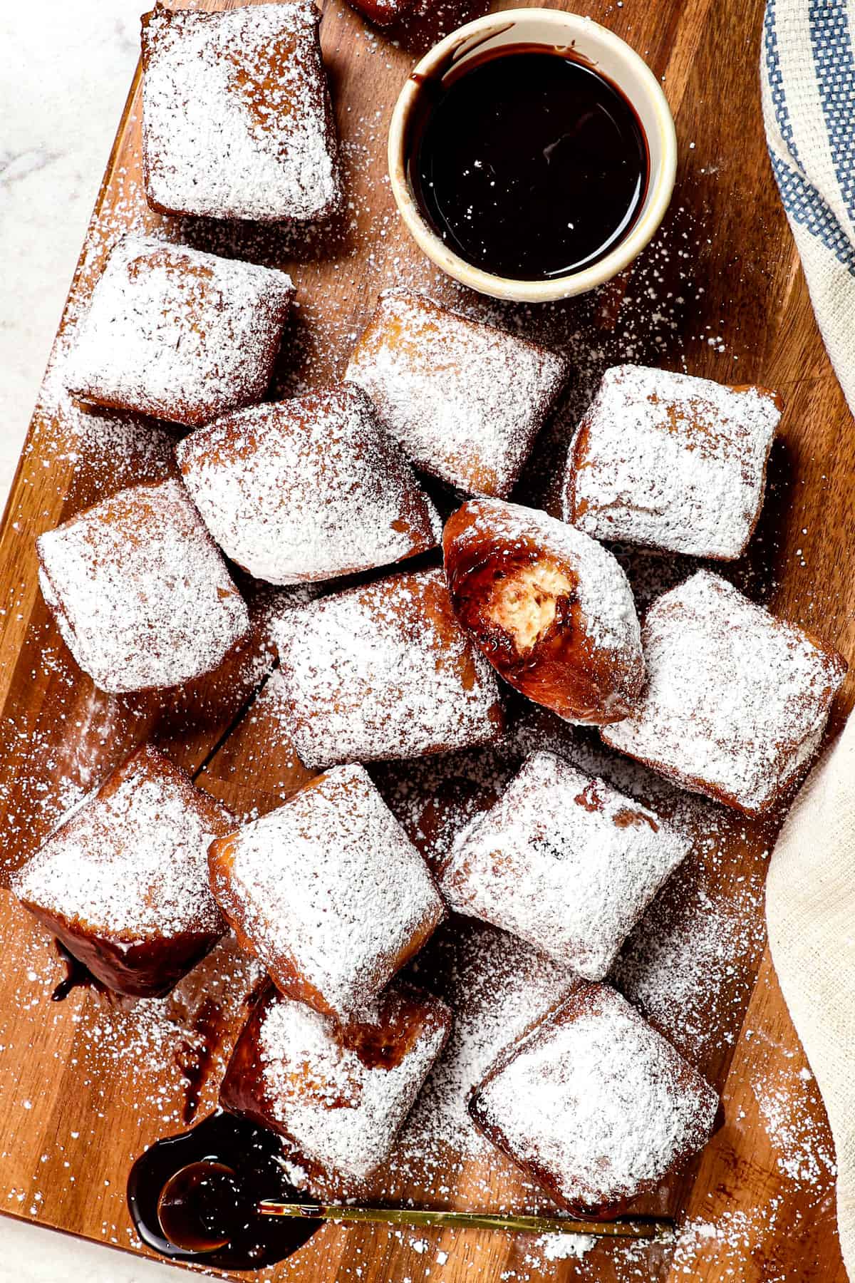 top view of beignets recipe being served with chocolate sauce
