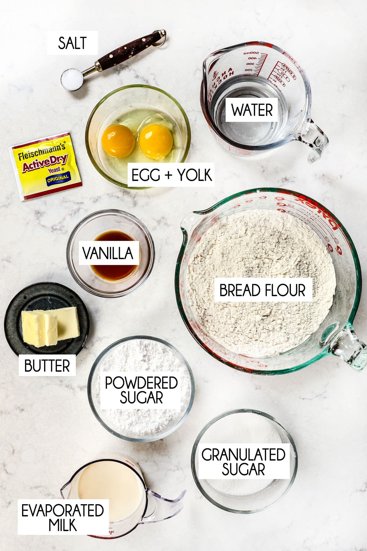beignet ingredient shot:  bread flour, milk, eggs, yeast, butter, sugar, water, powdered sugar