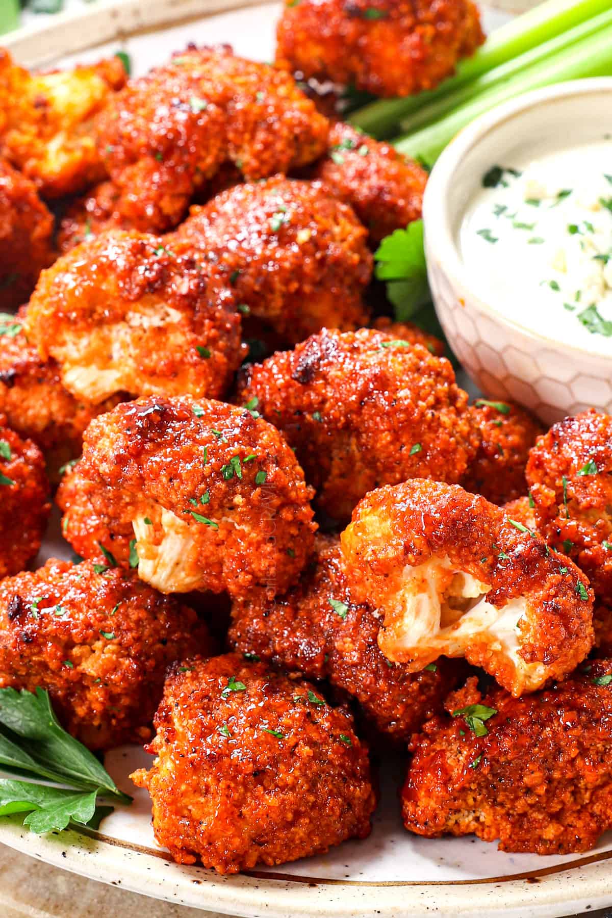 showing how to serve cauliflower buffalo wings with blue cheese dip