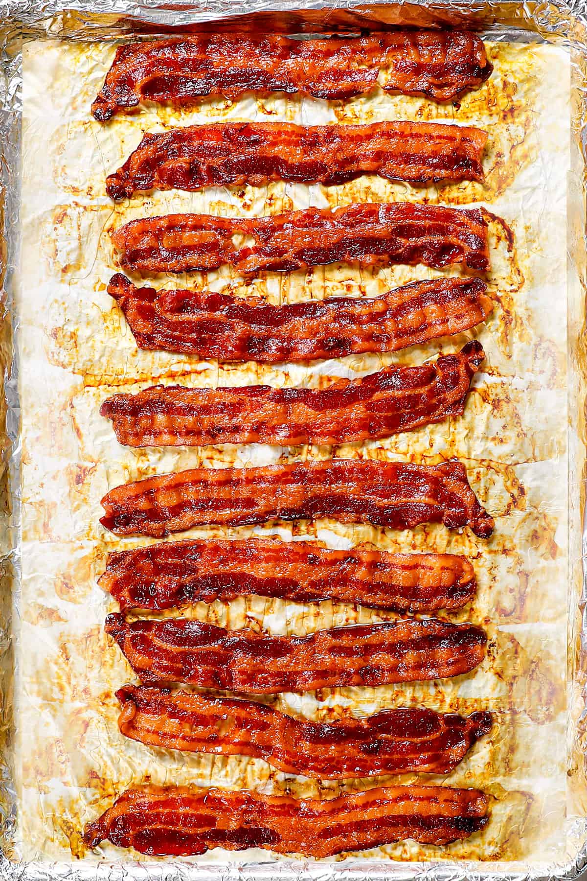 showing how to cook bacon in the oven by cooking until crispy 