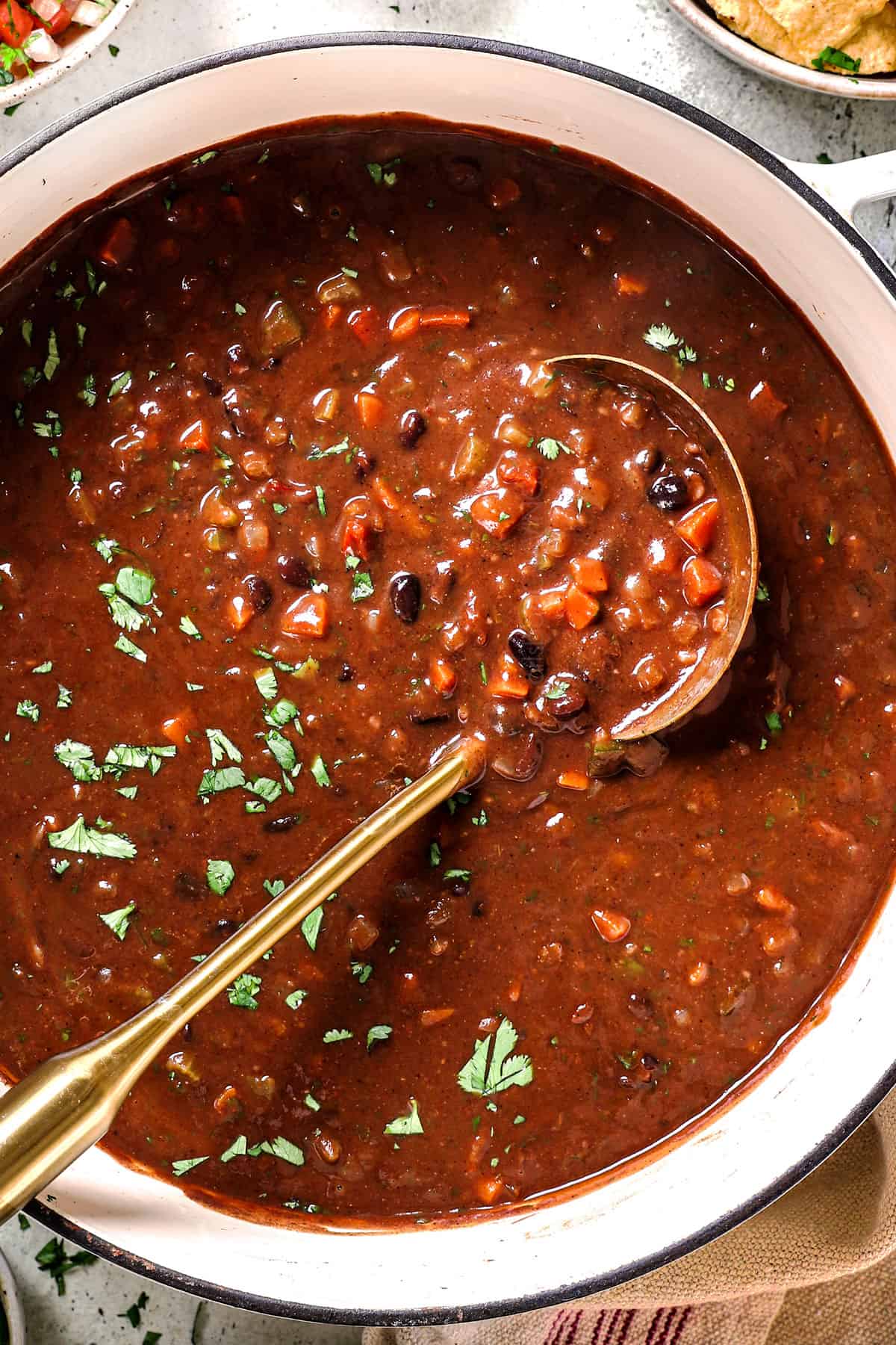 showing how to make black bean soup by seasoning to taste with extra salt