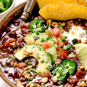 showing how to serve black bean soup recipe with chips, avocado, tomatoes, jalapeno and limes