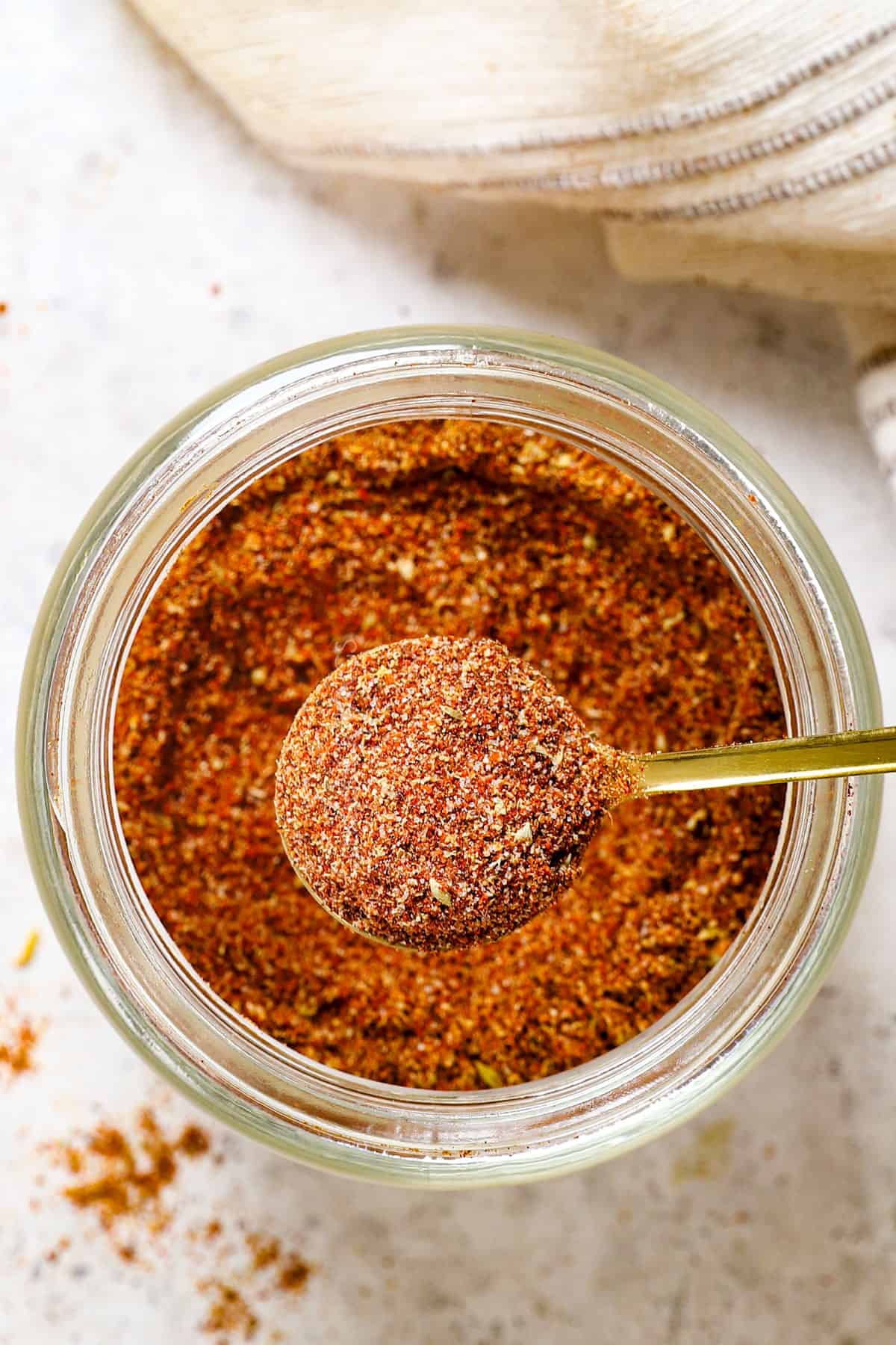 showing how to make taco seasoning by adding to an airtight container