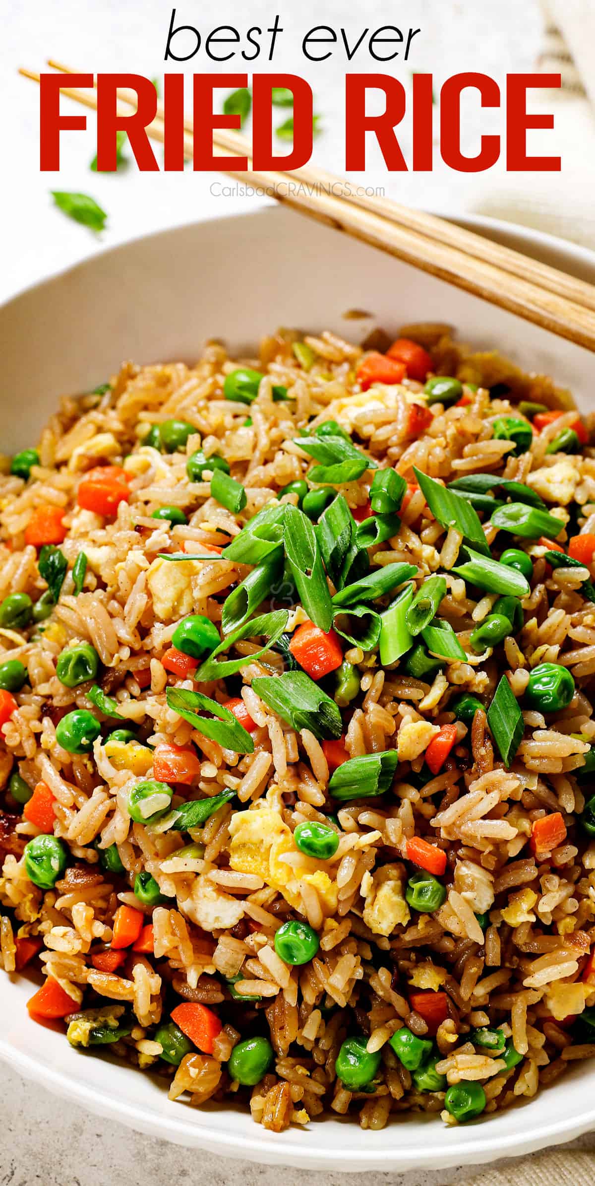 easy fried rice recipe in a bowl garnished by green onions