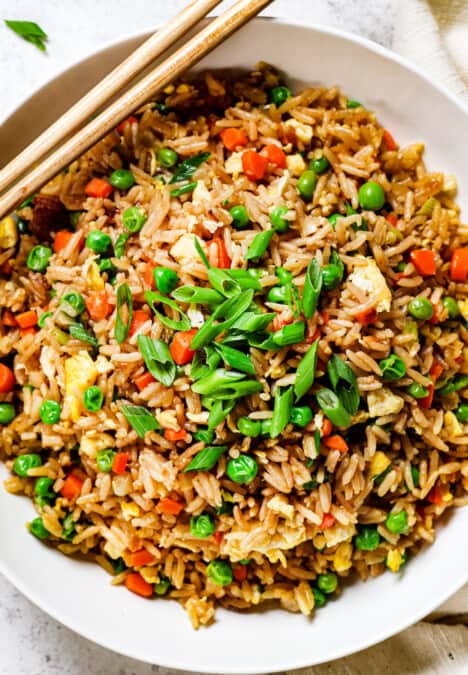 showing how to eat easy fried rice in a bowl with chopsticks