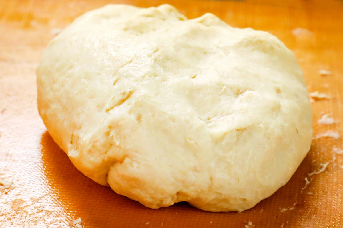 showing how to make pierogi by kneading pierogi dough with hands
