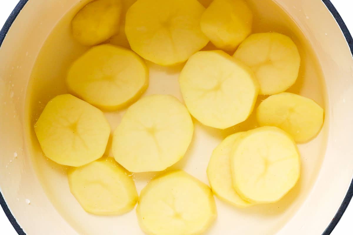 showing how to make pierogi by boiling potatoes for pierogi filling