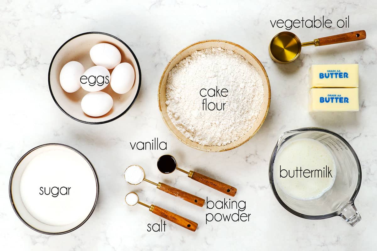 top view showing ingredients for Chantilly Cake:  cake flour, eggs, sugar, buttermilk, vanilla and baking powder