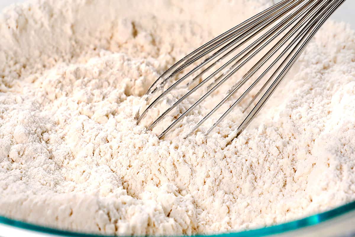 showing how to make Irish soda bread by whisking dry ingredients together