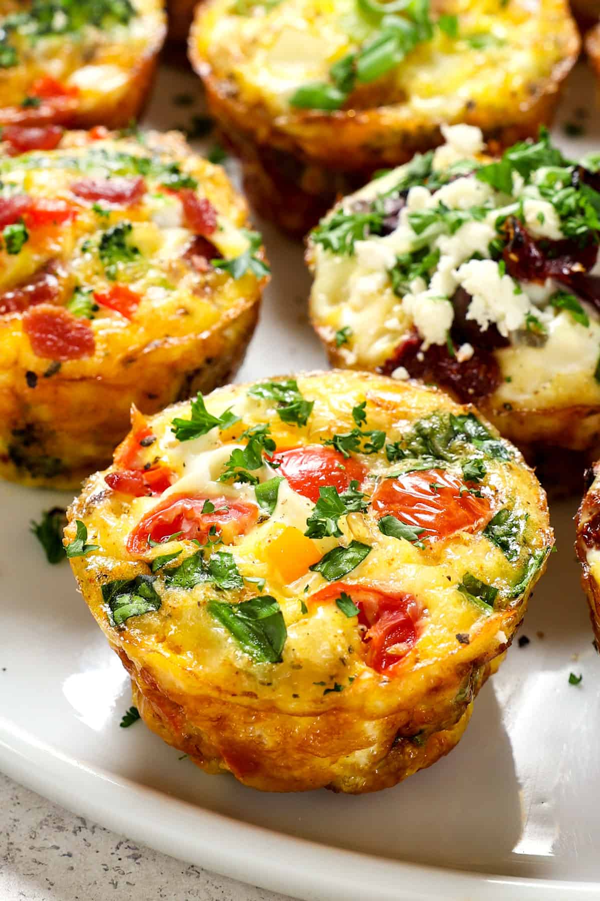 up close of egg cups with eggs, tomatoes and spinach