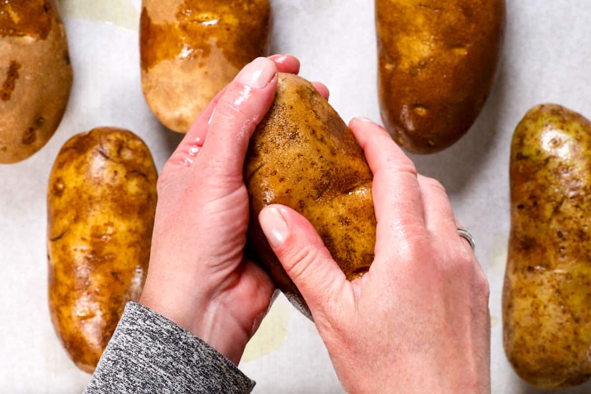 showing how to make a baked potato in the oven by adding oiling potatoes with olive oil  