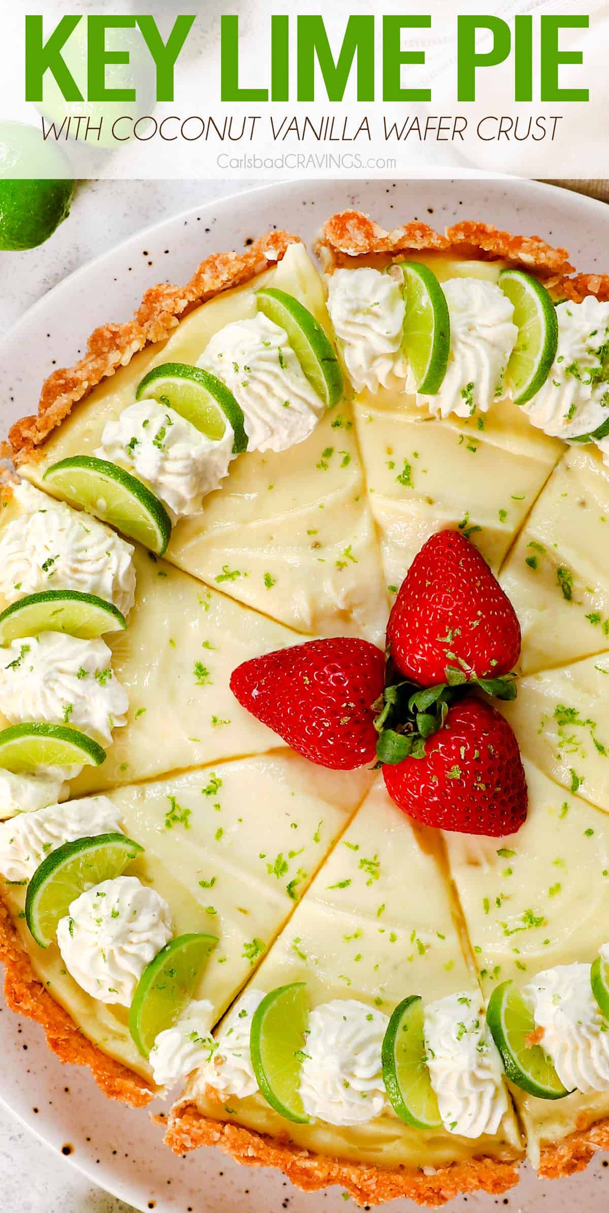 top view of key lime pie garnished with lime slices and whipped cream