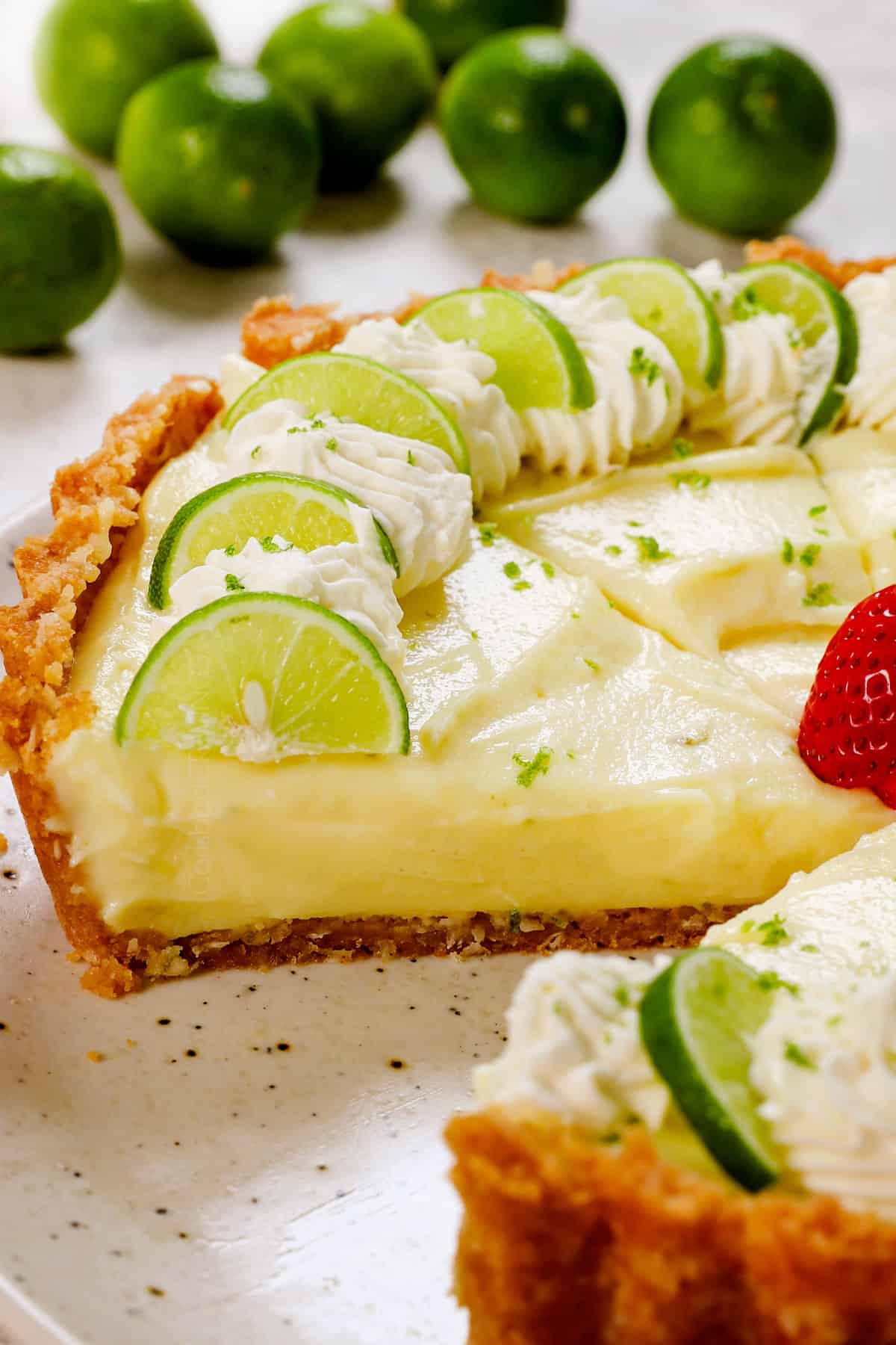 a slice of homemade key lime pie showing the custard-like filling that's thick and stable and not runny