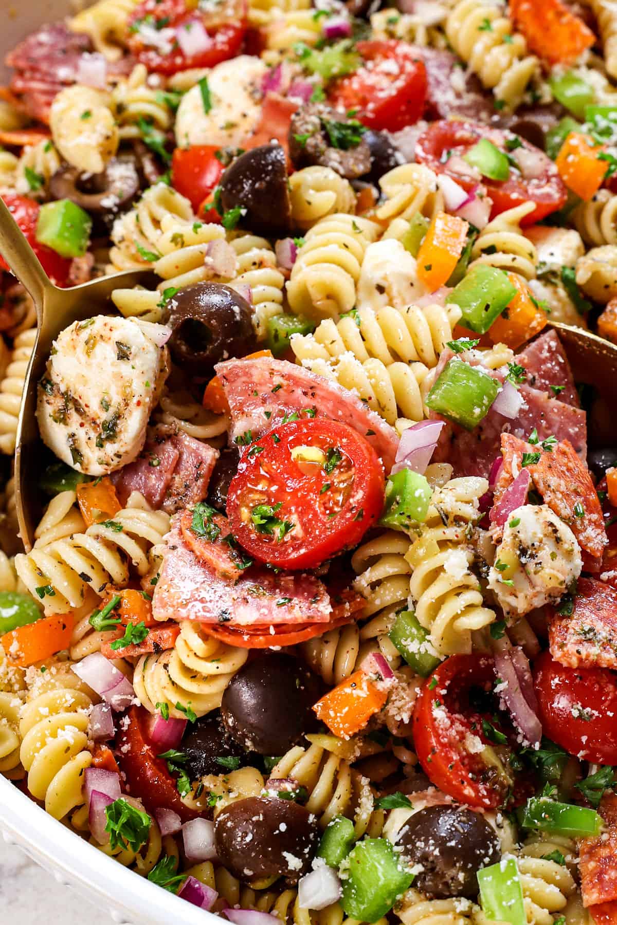 up close of serving pasta salad with italian dressing 