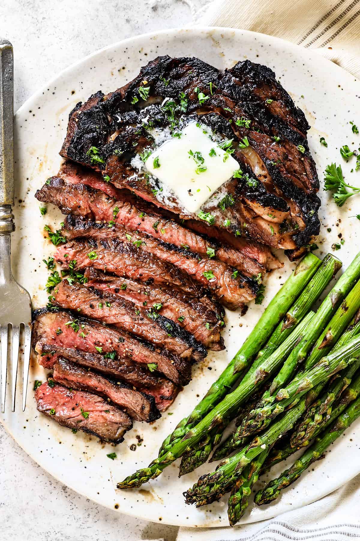 steak marinade recipe with a cooked steak on a plate sliced