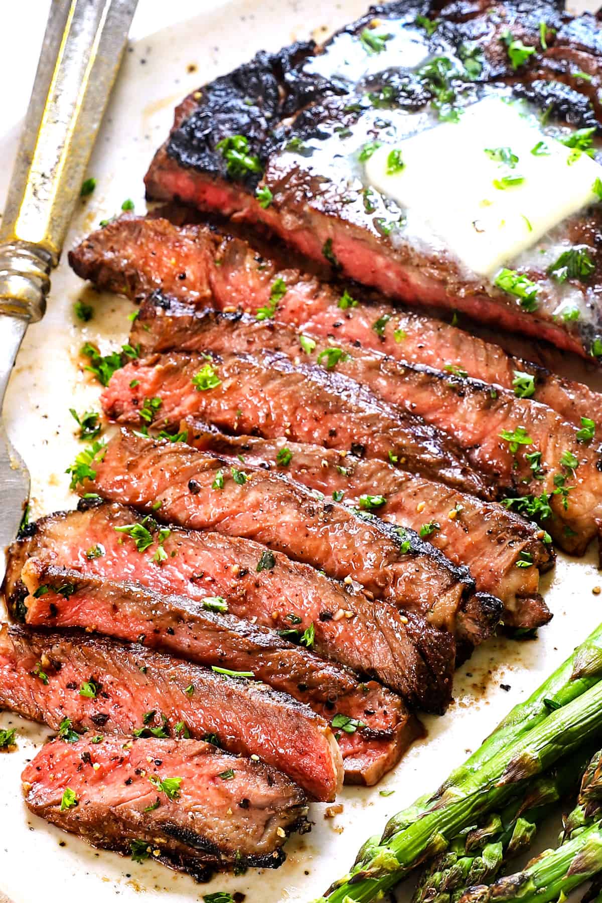 best steak marinade on a plate served with asparagus