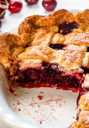 up close of cherry pie showing how thick and jammy the filling is