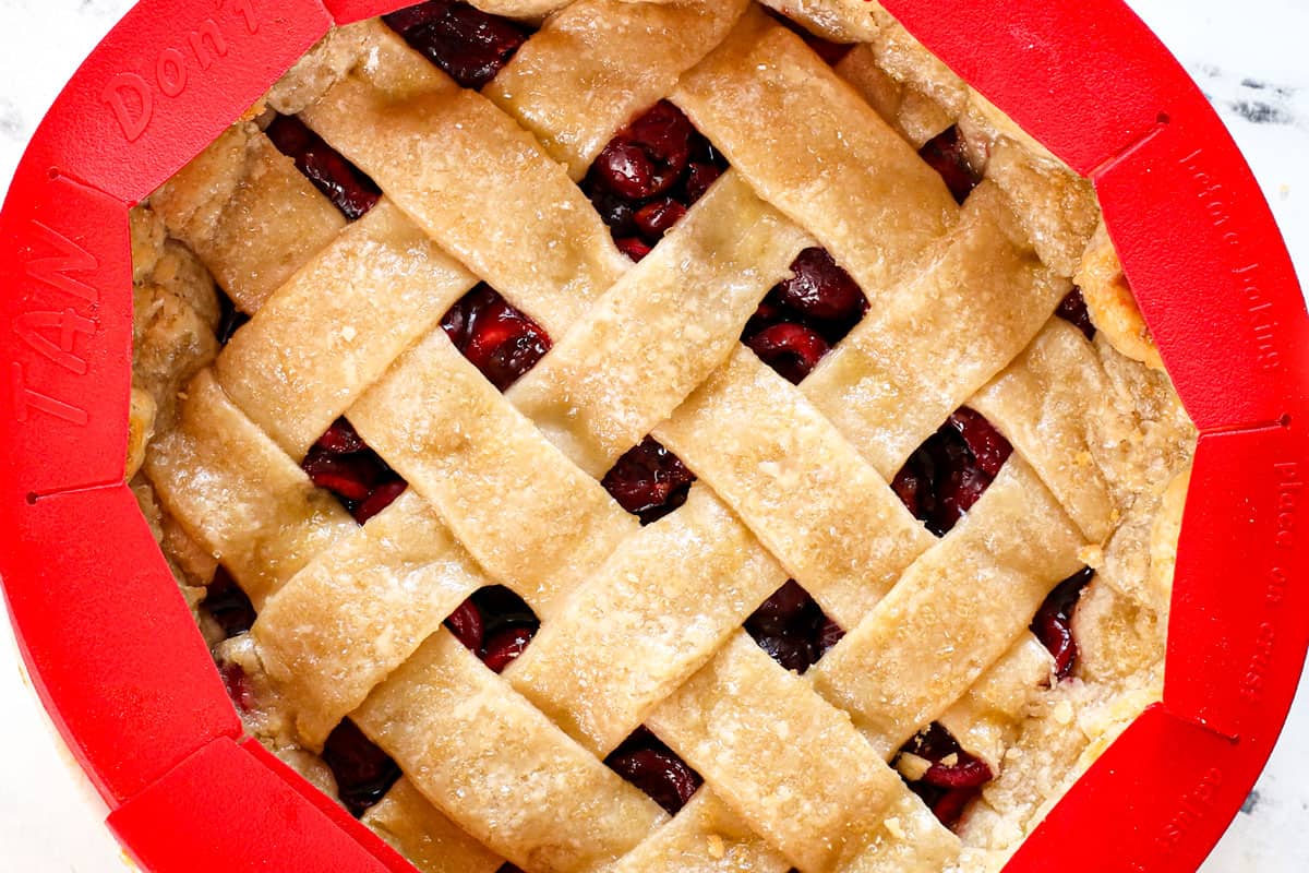 showing how to make cherry pie by baking, then adding a pie shield around the edges