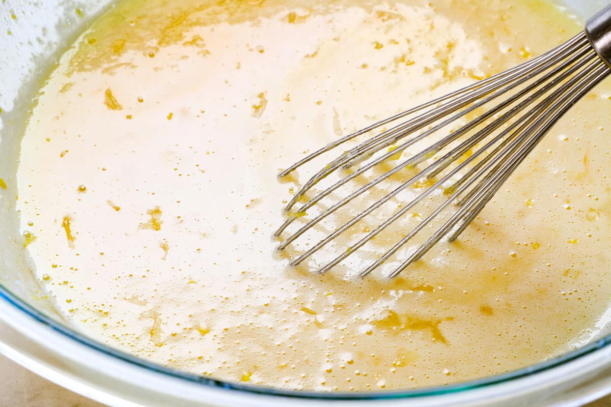 a collage showing how to make lemon bars by whisking the lemon filling ingredients together in a bowl, then pouring over the shortbread crust