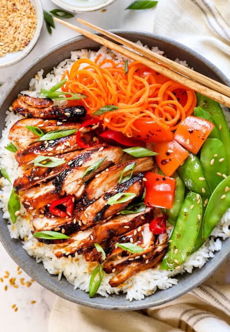 showing how to serve Asian chicken marinade recipe in a bowl with rice and vegetables