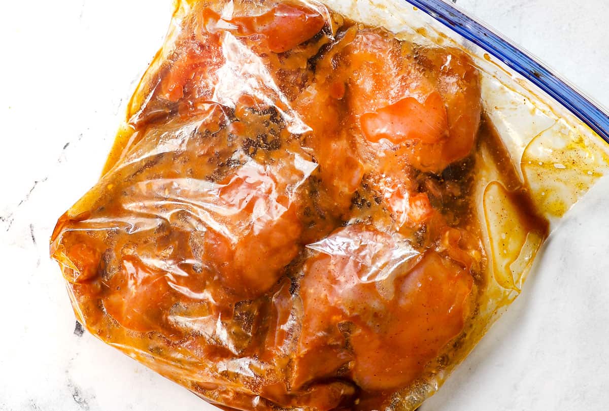 showing how to make Asian chicken by marinating chicken in a bag