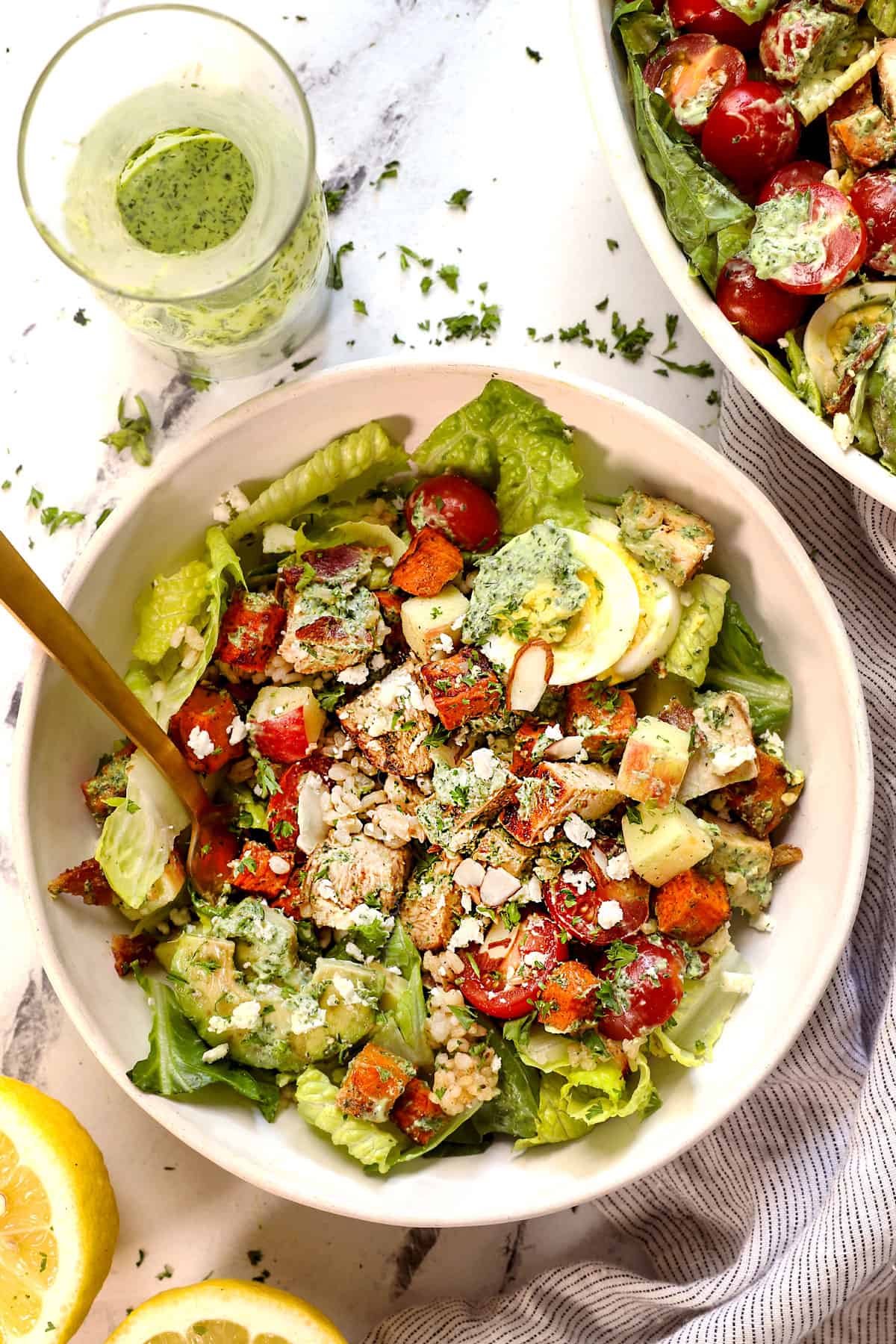 showing how to serve green goddess salad recipe in a bowl 