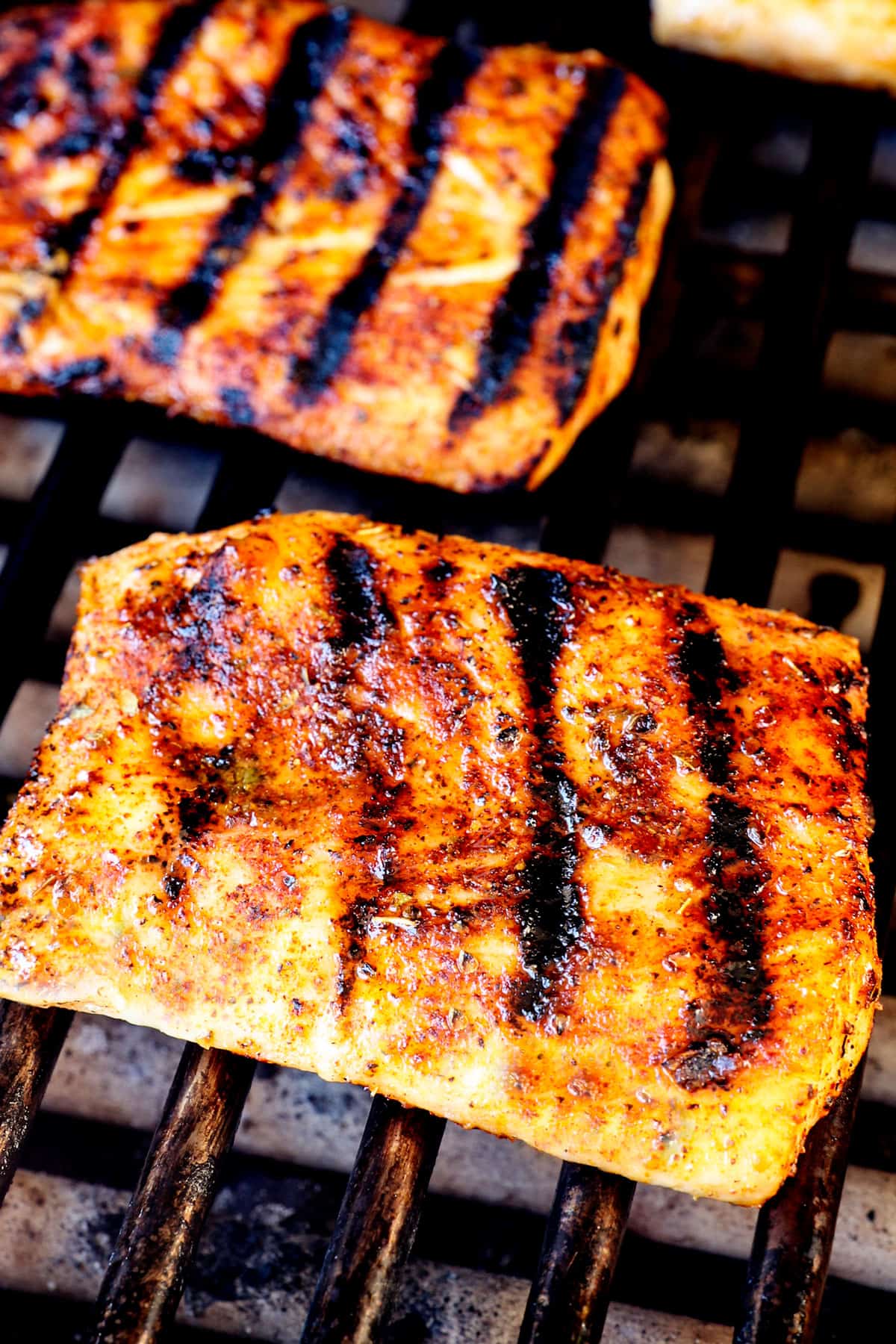 showing how to grill mahi mahi by grilling the fish until golden 