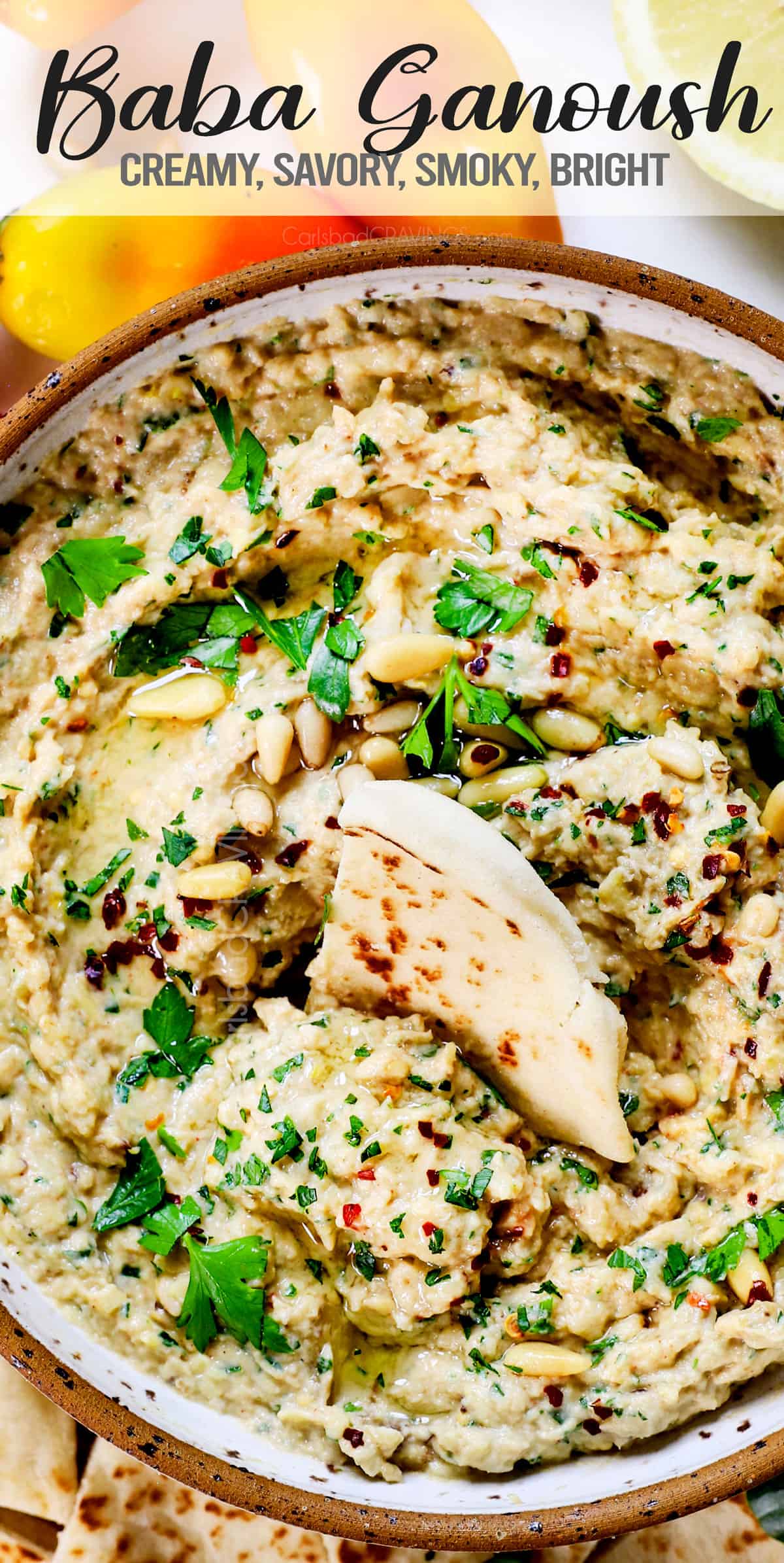 top view of dipping into baba ghanoush with pita bread