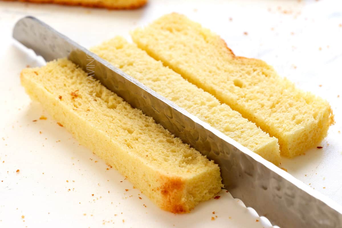 showing how to make French toast sticks by slicing bread into batons