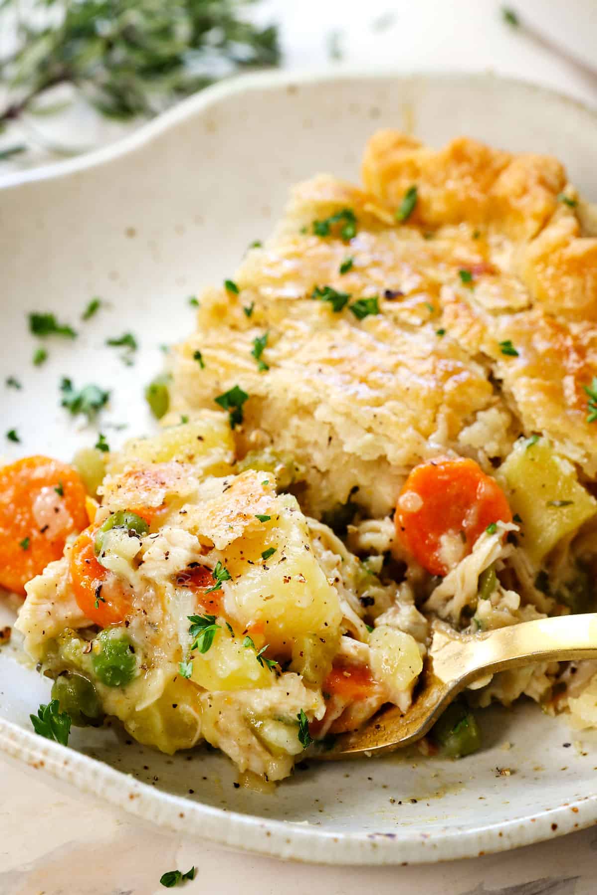 up close of taking a bite of homemade chicken pot pie recipe