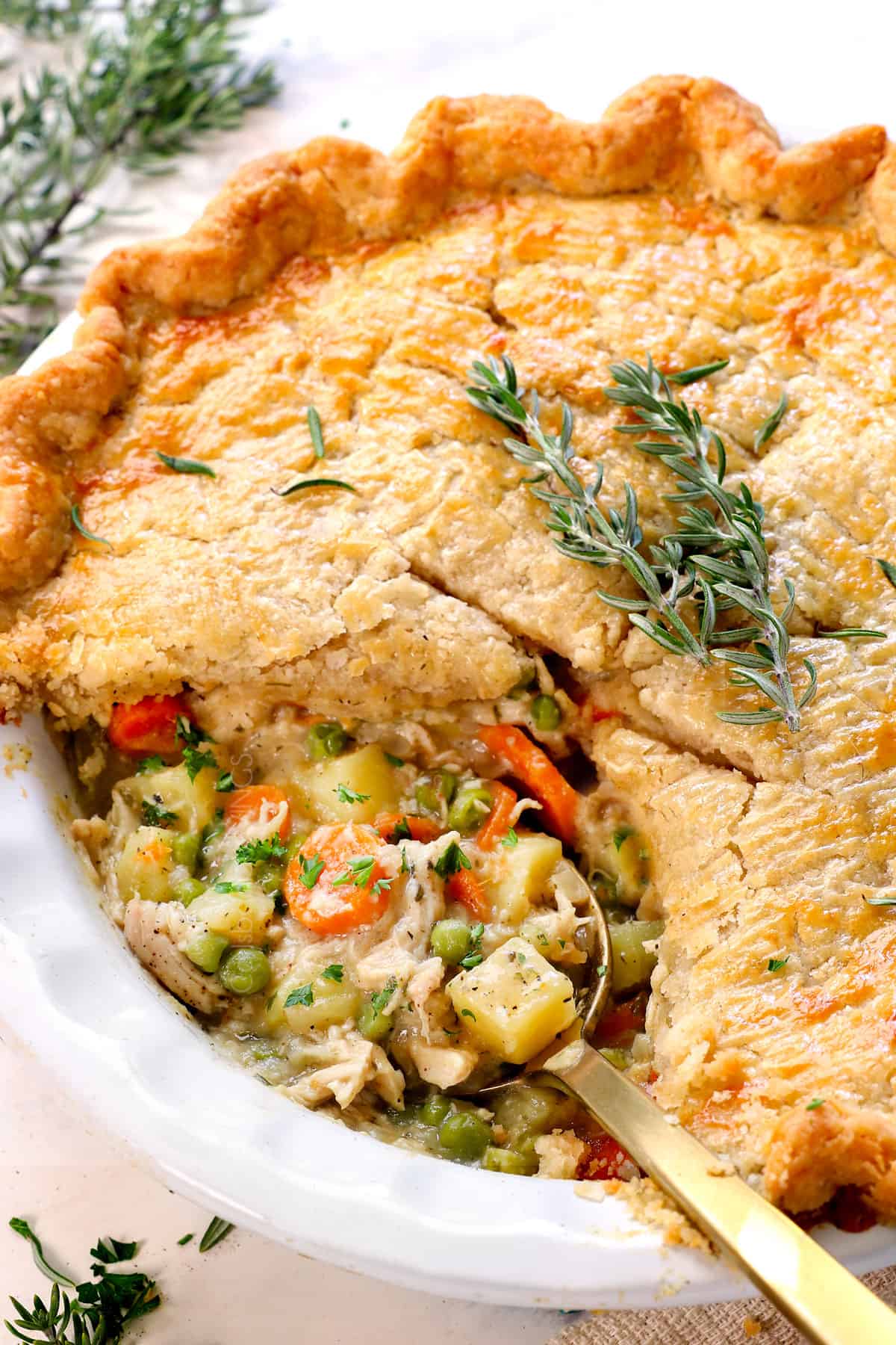 chicken pot pie recipe with a slice removed showing how creamy the filling is