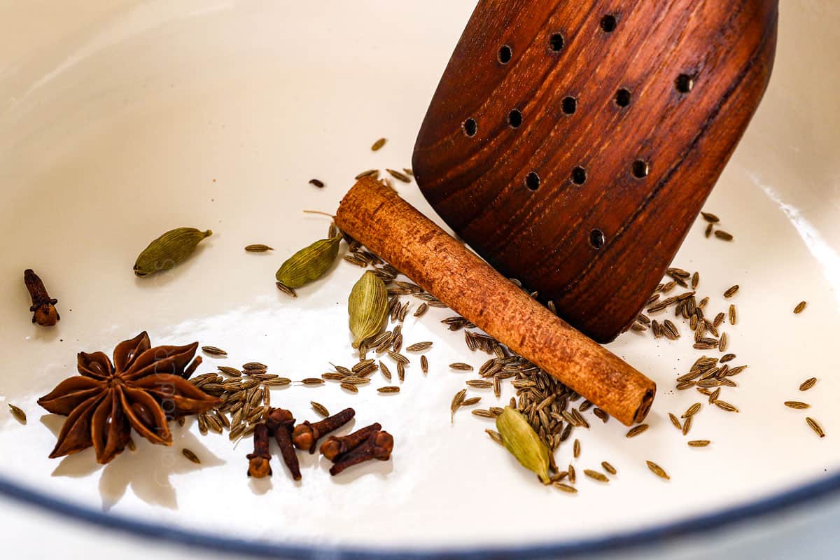 showing how to make biryani by toasting the whole spices