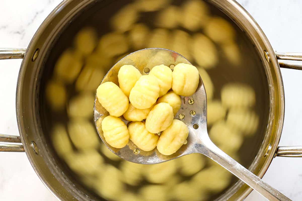 showing how to cook gnocchi by boiling in water until tender.