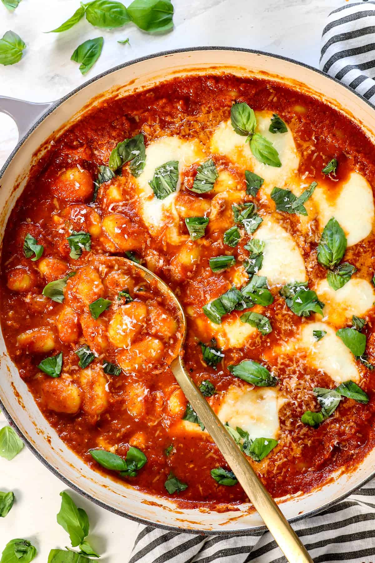 gnocchi sorrentina topped with mozzarella and basil 