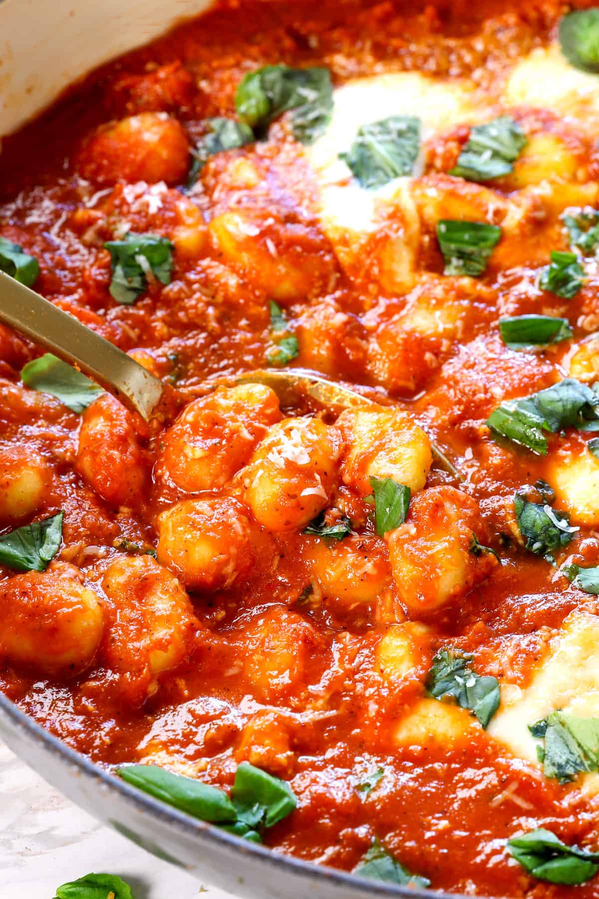 up close of baked gnocchi recipe showing the tender gnocchi and rich sauce