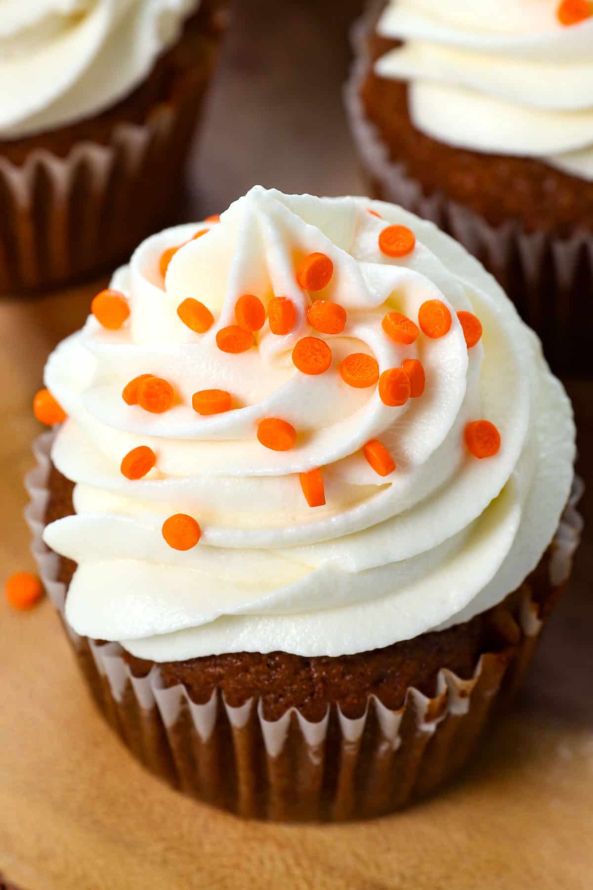 showing how to frost pumpkin cupcakes with cream cheese frosting