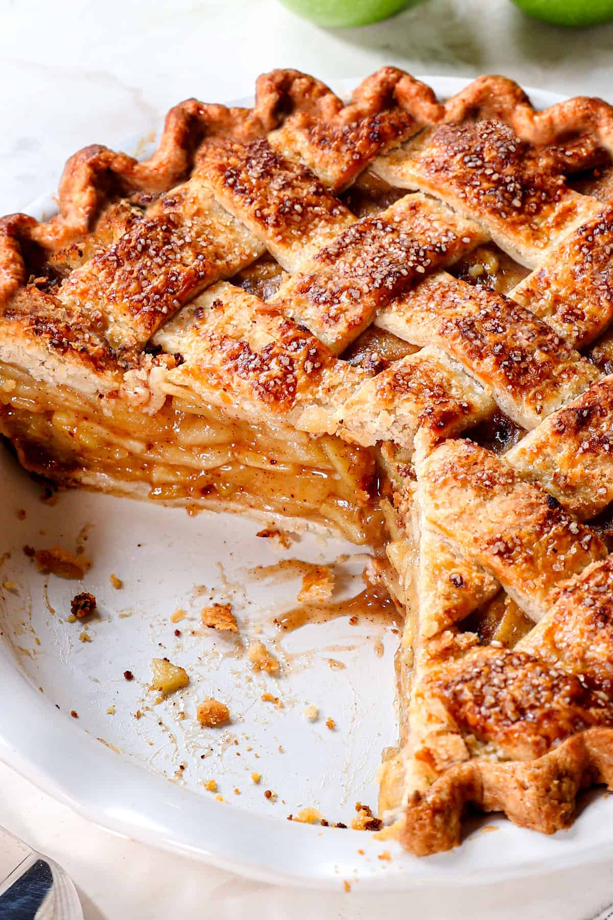 homemade apple pie with slices removed showing the layers and layers of apples 