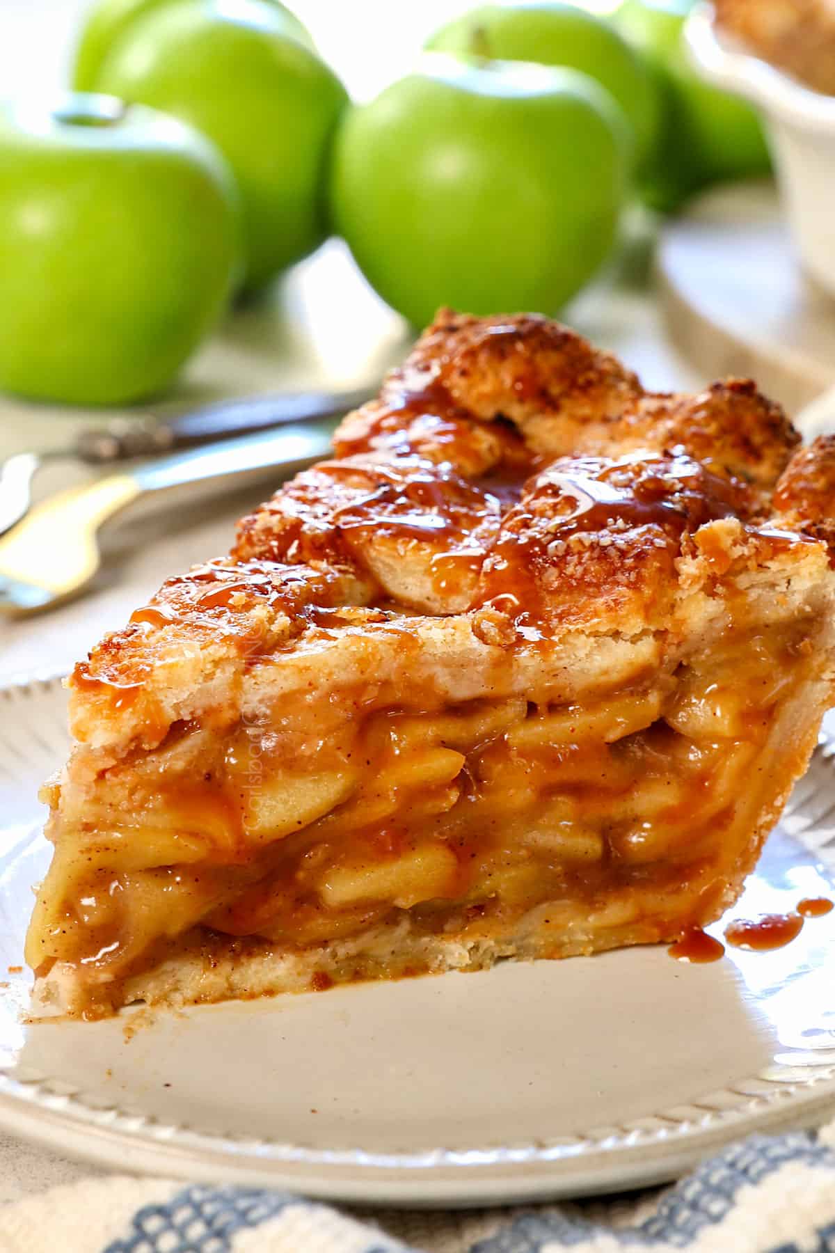 lattice apple pie with homemade pie crust and apple filling served on a plate