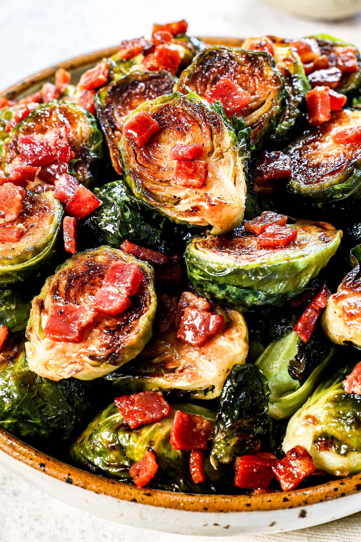 bacon Brussel sprouts recipe in a bowl with caramelized, crispy edges